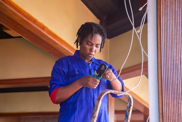 Person working on electrical wiring