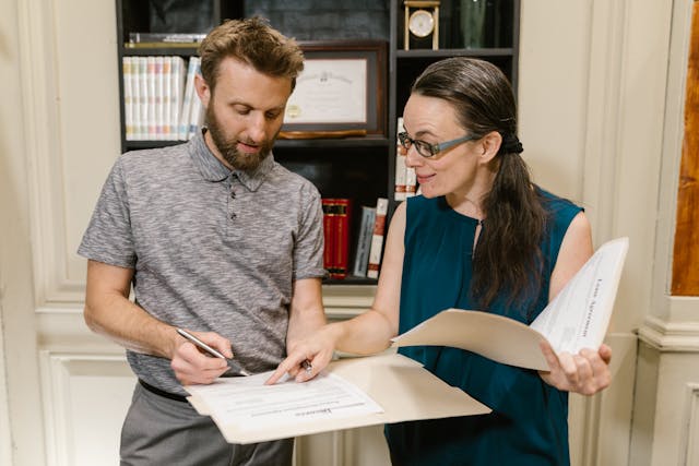 property manager and tenant going over leases