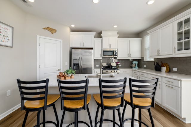 Kitchen island with barstool chairs