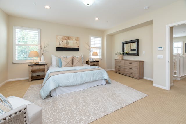 bedroom with large bed in the center