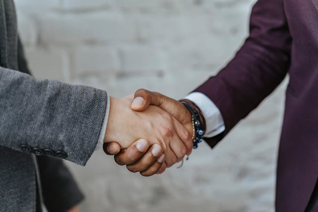 landlord shaking hands with property management